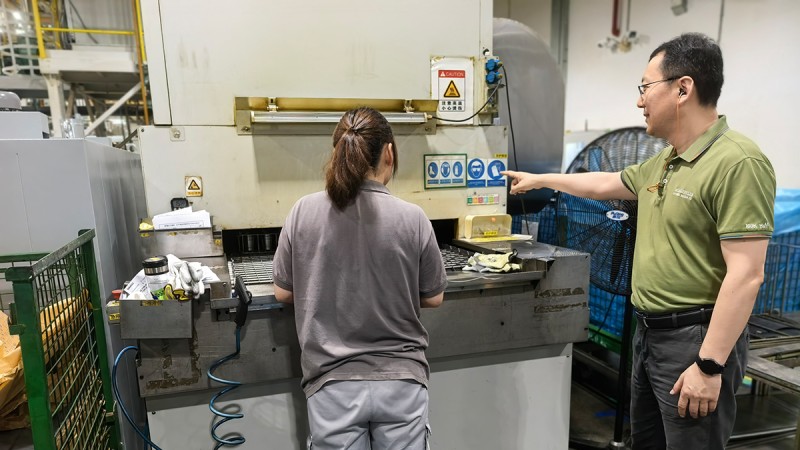 Dr. Ning Shuangli during a walk-through of the plant.